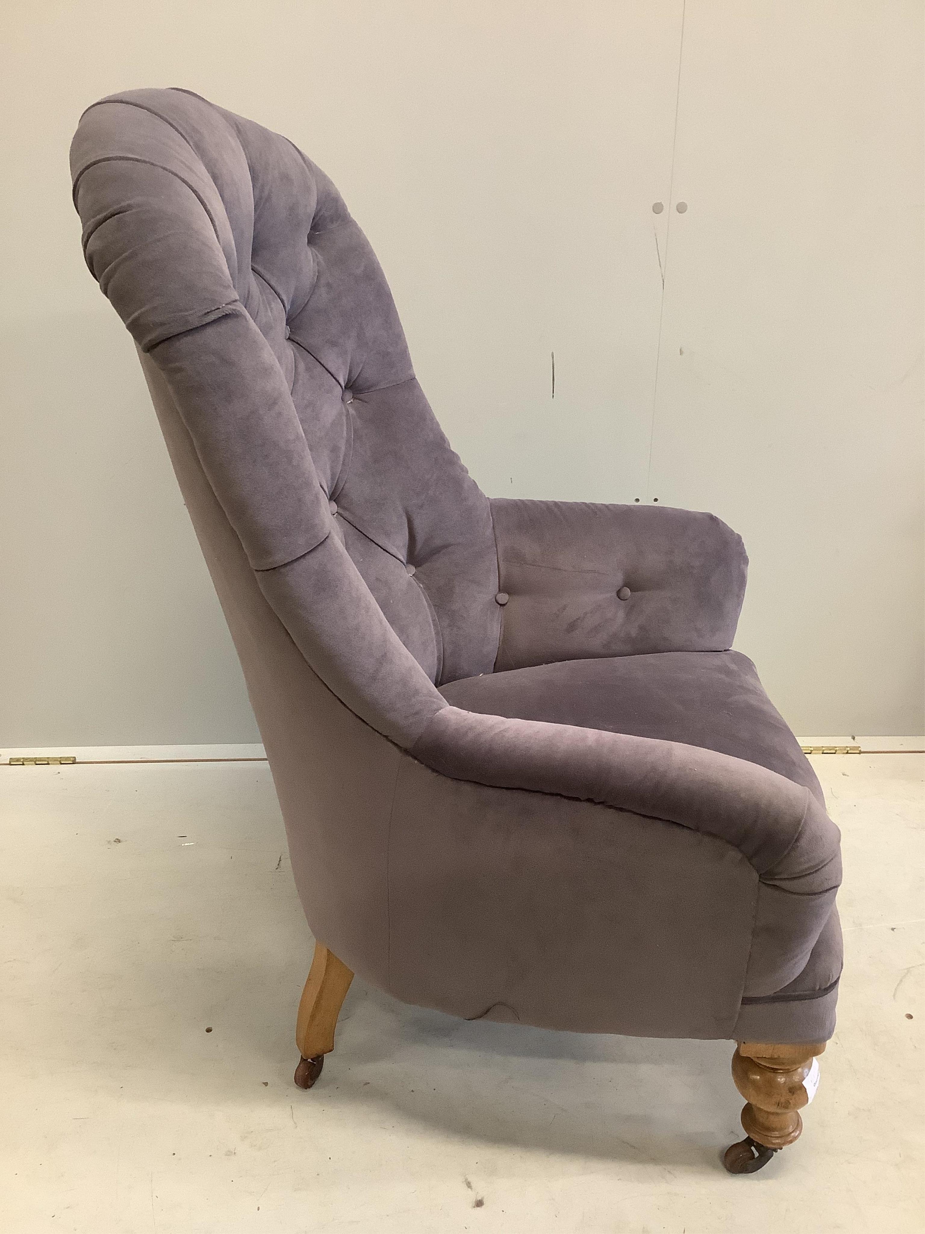 A Victorian upholstered spoonback armchair, width 68cm, depth 60cm, height 102cm. Condition - fair